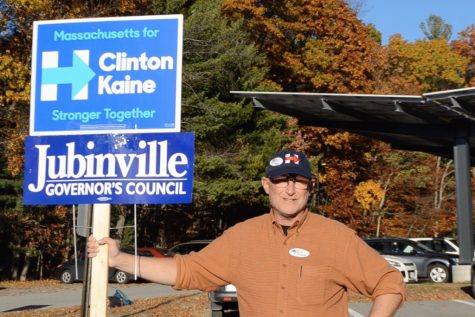 Wayland residents hold signs outside polling stations (Video)