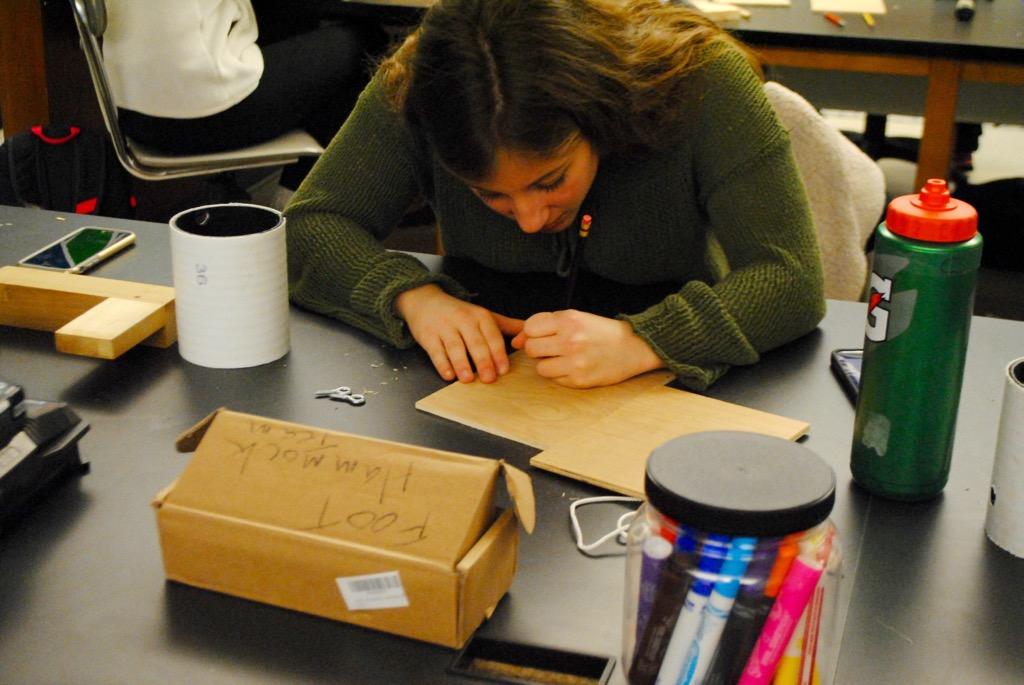 Pictured above is a student building a birdhouse at History Department Head Kevin Delaney's woodworking workshop. Delaney hosted the workshop in the makerspace on Friday as a part of WHS' annual winter week.