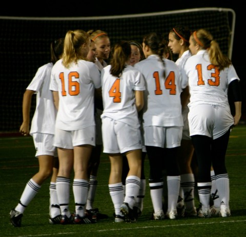 The team in a huddle during their game against Brookline on Saturday. (Credit: The Jurist Family)