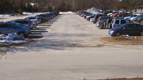 Current student and faculty parking longs on the west side of campus will be walled off next year as construction on the new high school building begins. (Credit: David Ryan/WSPN)