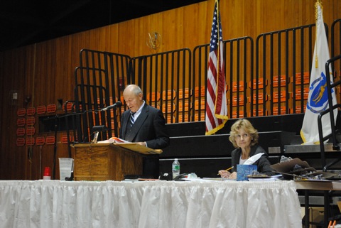 The town moderator oversees debate on the town meeting floor during a recent town meeting.