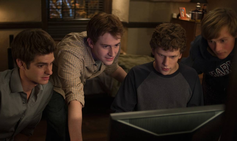 Mark Zuckerberg (third from left, played by Jesse Eisenberg) at Harvard where he created the website TheFacebook, which spawned into Facebook - the most popular online social network in the world. (Courtesy of Columbia Pictures)