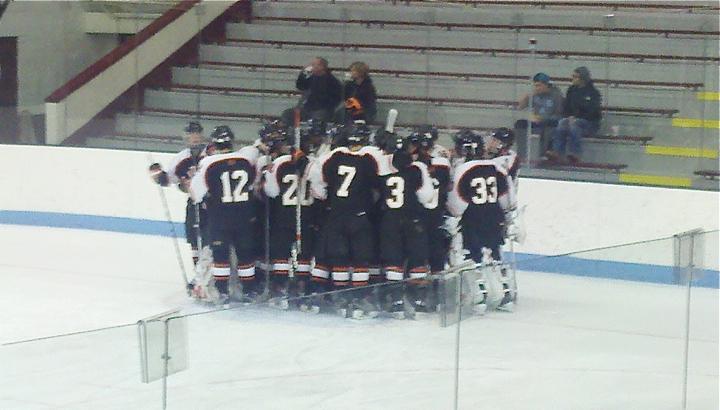 Wayland Warriors huddle up before their big game against Shawsheen. (Credit: Riley Starr/WSPN)