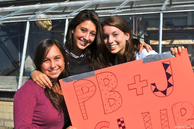 PB & J club leaders (from left to right) Ksusha Ryabin, Alli Diamond and Laura Vancil recruited students to join their club during Club Fair last year. In years past, PB & J club only met during club block, but this year, they have had to find an alternative. (Credit: Riley Starr/WSPN)
