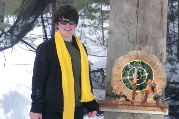 Sophomore Liam Fay with his bulls eye at the Klondike Derby Ax Throwing Competition (courtesy of Ron Hereema)