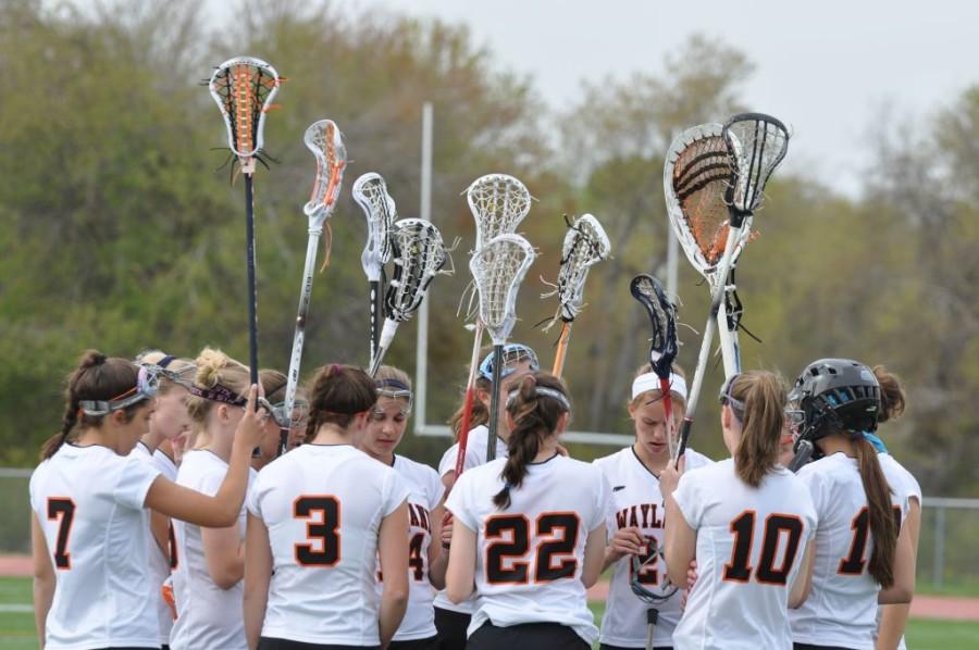 The girls lacrosse team, like many other teams, have various types of athletes who come together in high school to play on the same team. 