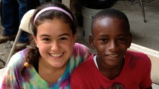 This summer, Daisy Lin went on a volunteer expedition to Haiti where she helped out at a Mission E4 orphanage. Above, Lin smiles with her sponsor child, Jerry, during her trip.