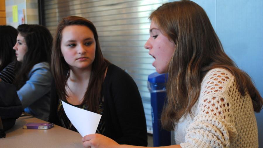 This year, Wayland High Schools peer mentorship program has been redesigned, so mentors and their mentees can build a stronger relationship. Above, junior Julia Terranova (right) plays a get-to-know-you activity with one of her peer mentees. 
