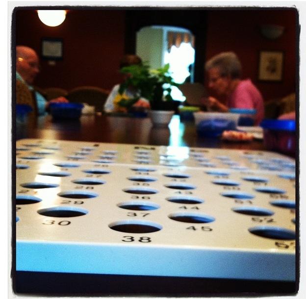 Every Saturday, sophomore Anna Downs volunteers at Traditions of Wayland by playing bingo with the residents.