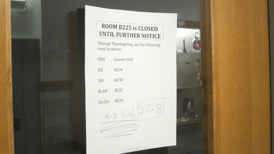 Pictured above is a sign on the business lab door directing students to where they should go for classes. This past August, mold was found in the room, and for nearly a week in November, the room was closed so that the mold could be abated. I was bothered that something that was supposed to require immediate action took three months,” business teacher Jim Page said. 