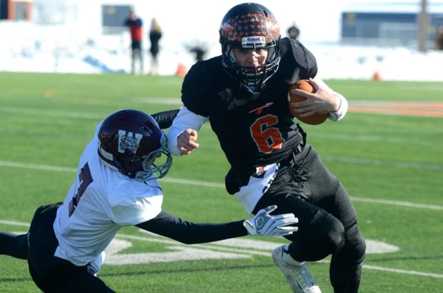 Above, is quarterback Robert Jones in the annual Thanksgiving game against Weston. WSPN gives you a summary of the Warriors season.