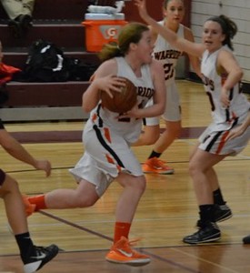 Above is sophomore Ellery Kiefer playing basketball. Kiefer has been playing basketball most of her life and just finished her second season on the WHS team. "I’ve played basketball since I could walk. I played in this little league and there were just a bunch of little kids learning to play basketball," Kiefer said.