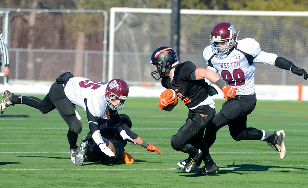 Pictured above is Wayland WR/CB Jimmy Lampert carrying the football against Weston’s defense during last years Turkey Day game. The annual game this year will take place on Thanksgiving (November 26) at 10 am at Weston High School. “I think it is a great way to end the season. What’s better than playing your rival on the last game of the year and on Thanksgiving when everyone is home?” Head Coach Scott Parseghian said.
