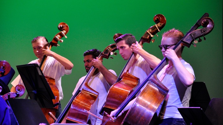 Above, senior Anthony Schleppi (second from right) and junior Chris Laven (far right) perform in an orchestra concert. Both will perform in the All-State music festival, Schleppi in the chorus and Laven in the orchestra. “I think this year was an extraordinary year, to have [eight] students selected and participating in the highest honor in our state,” Fine Arts Department Head Susan Memoli said. 