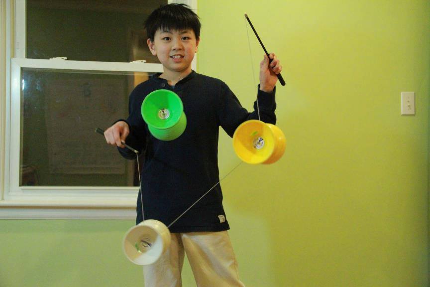 Wang practices triple yo-yo as a young child.