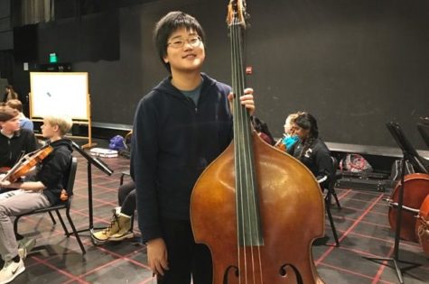 Above is freshman Jesse Wang with his bass. Wang will play in the All-State music festival this year, having put in years of practice to excel on bass. “#NeverGiveUp. Work hard at something that you want and be dedicated.” Wang said.