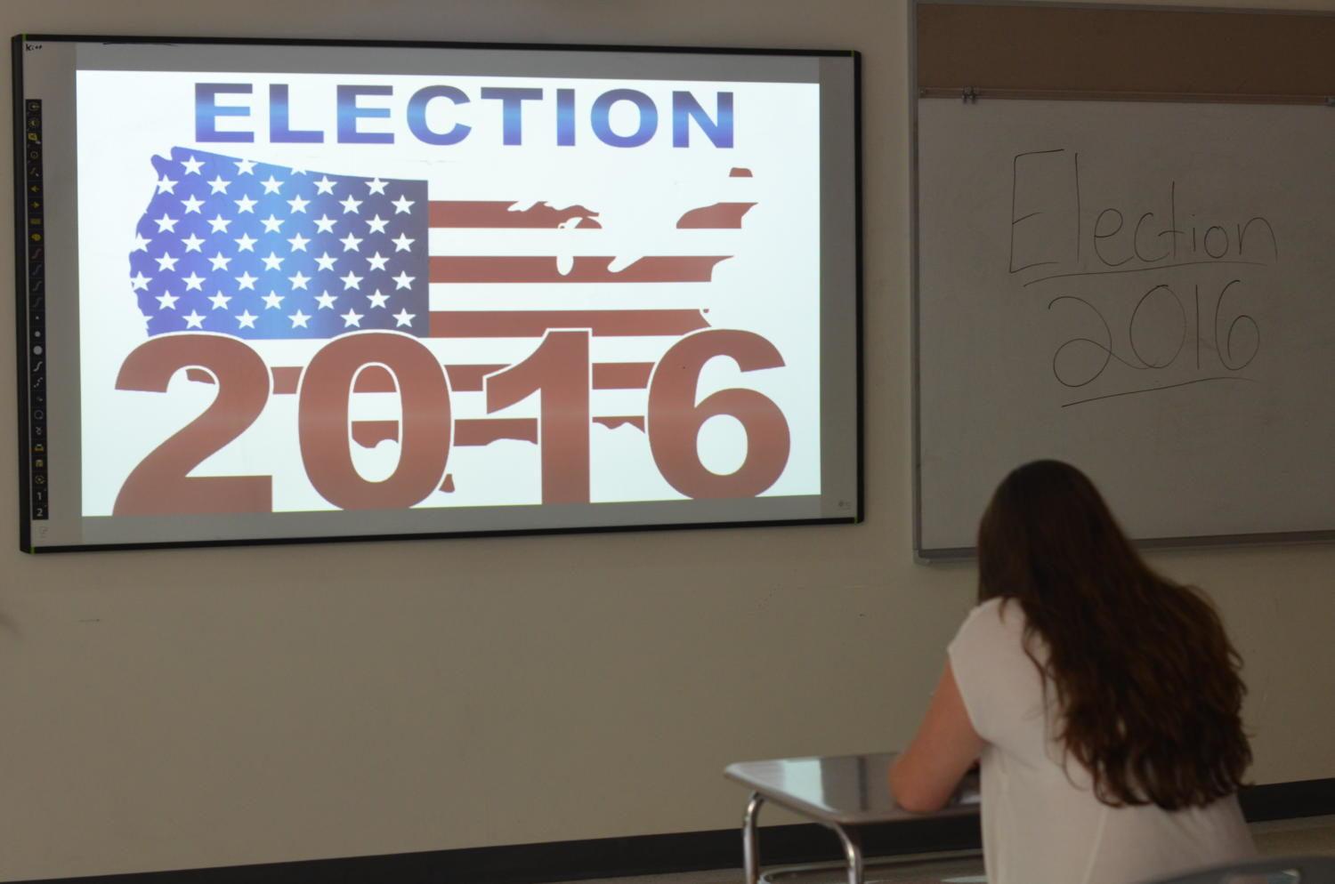 Photo Illustration: A student sits at her desk as her class discusses the 2016 election.