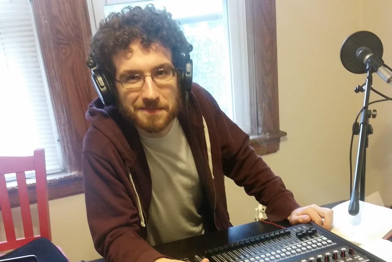 English teacher Kevin Vibert while recording an episode of The Penumbra Podcast. Vibert is the co-creator, co-producer, lead writer and reporting engineer for the podcast. "I've never worked collaboratively on a creative project before. It is super cool," Vibert said.