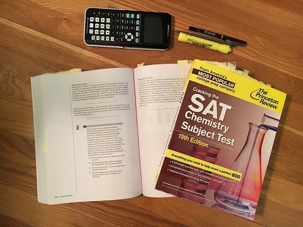 Pictured above are the different books and applications used by students to study for the SAT subject tests. Tools such as theirs are expensive, and valuable for studying. 