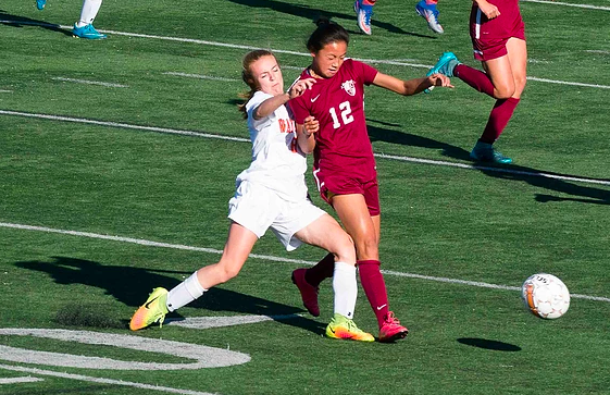 Pictured above is Poulsen fighting for the ball in her game against Arlington Catholic. 