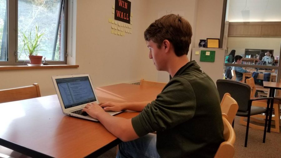 Pictured above is senior Tyler Brient coding a recent project. Brient is the creator of the website eSchoolPlusPlus.