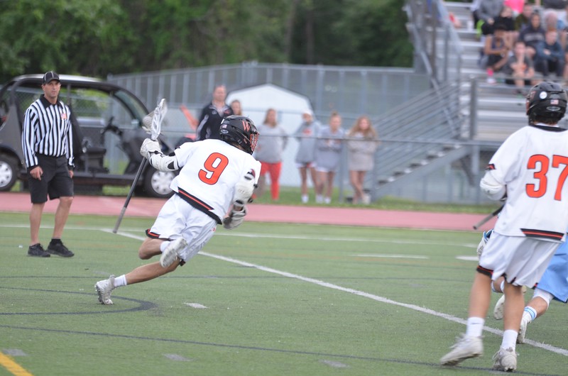 Senior Ben Travis cradles the ball.