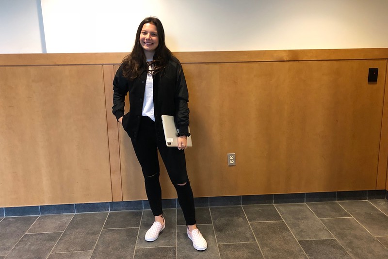 Junior Noelle Flanagan wears J.Crew, Vans, Vineyard Vines and Roots. 