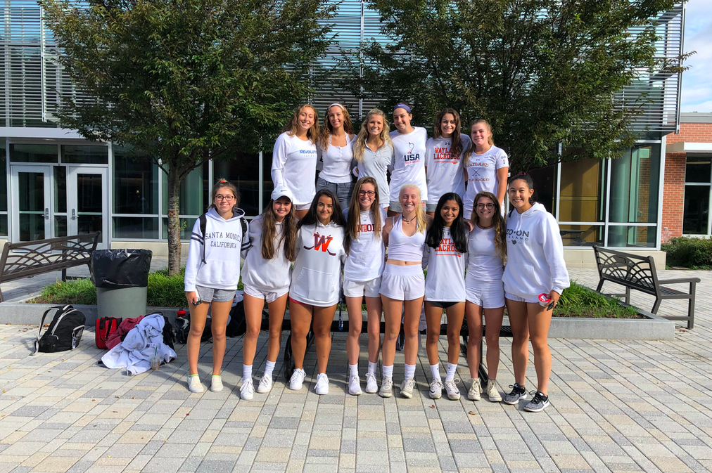 The girls' varsity field hockey team poses for a photo in for their