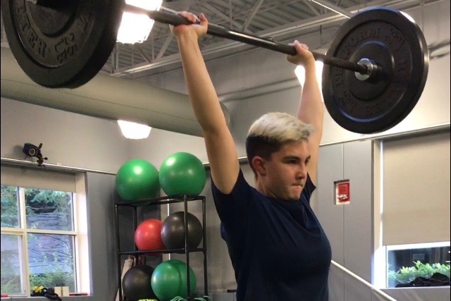 Sophomore Gracie Corbett jerks a 95 pound bar above her head. Corbett is a weightlifter. “I really like being healthy. I want to make sure I’m always healthy, Corbett said. 