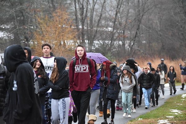 Students talk as they walk around the school. 