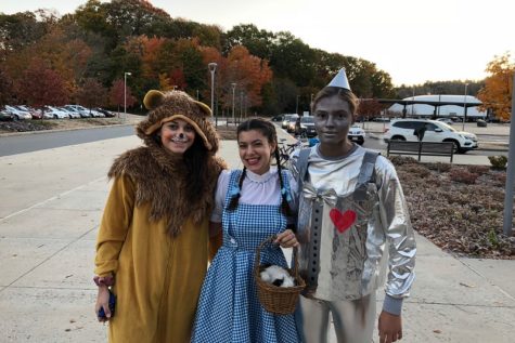 Seniors Emily Hanania, Annie Clarke and Emma Diianni dress as the Lion, Dorothy and the Tin Man on Halloween.