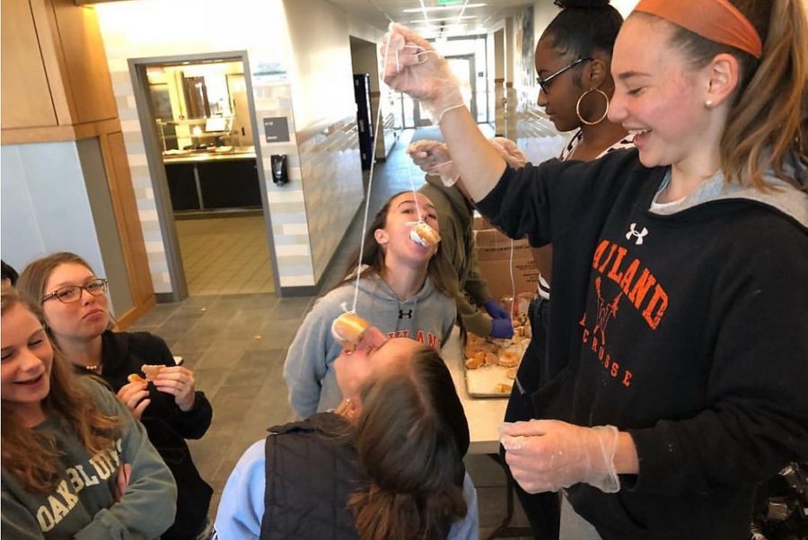 Students participate in a donut eating competition. This activity was planned by the new Student Council as part of its efforts to engage the student body. “We want to be more involved and we want people to know what Student Council does and why we’re here,” Cabral said.