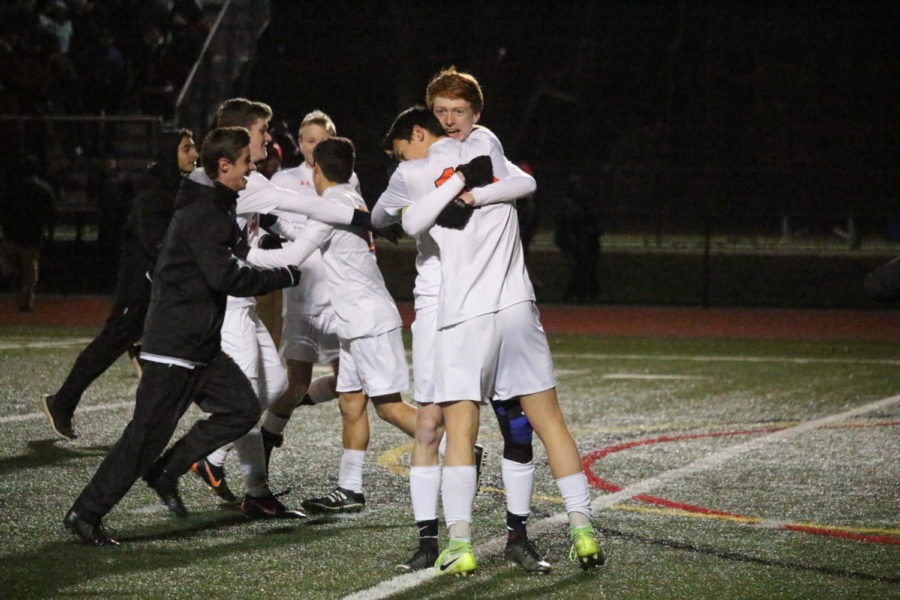 Fuller and Tyska embrace after clinching a 2-1 win against Holliston in the state semifinals.