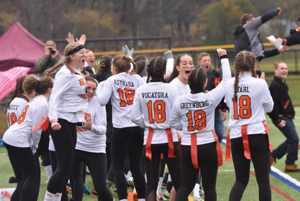 Players and coaches celebrate after winning last years Powderpuff game. This year, the team has been working hard to prepare for the game and hopes to win. I think that we can beat Weston because we’ve been having a lot of practices and we’ve been learning a lot of new stuff, senior Samantha Neuman said.