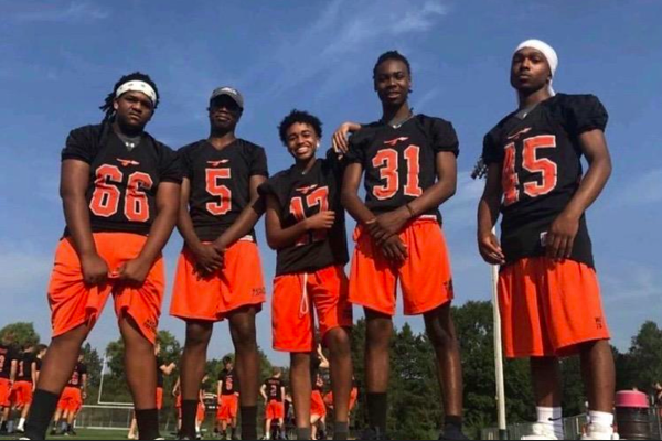 Juniors Kuran Freeman, Jaden Brewington, Shawn Bernier, Kael Bonds and Franky Gonzalez pose during football practice. Bernier, Bonds, Freeman and Gonzalez kneeled during the National Anthem throughout the 2017-2018 football season. “I have decided to make different statements verbally rather than taking a knee,” Bernier said.