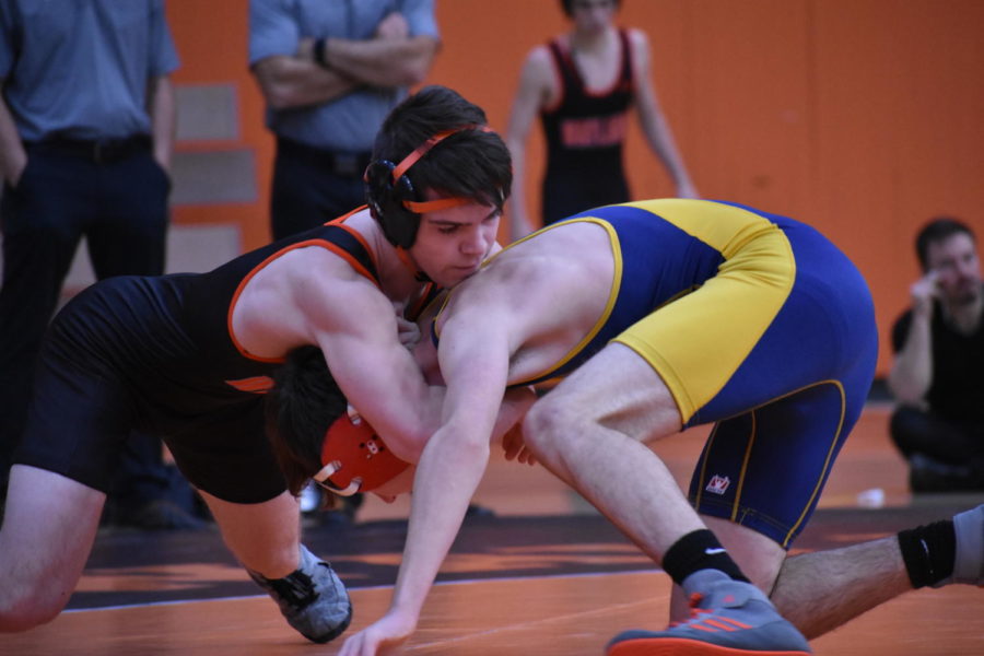 Senior Erik Sweeney wrestles his Lexington opponent and believes the teams' hard work in practice is what leads to their success. "We prepare for [meets] by grinding in practice and being in the best shape that we can. We keep the foot on the gas,” Sweeney said.
