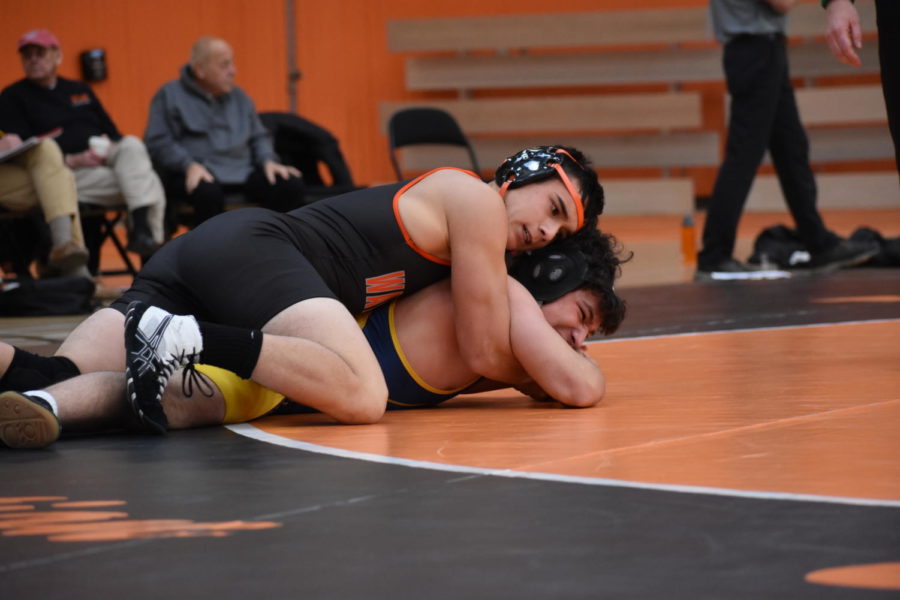 Junior George Natsis pins his Lexington opponent.