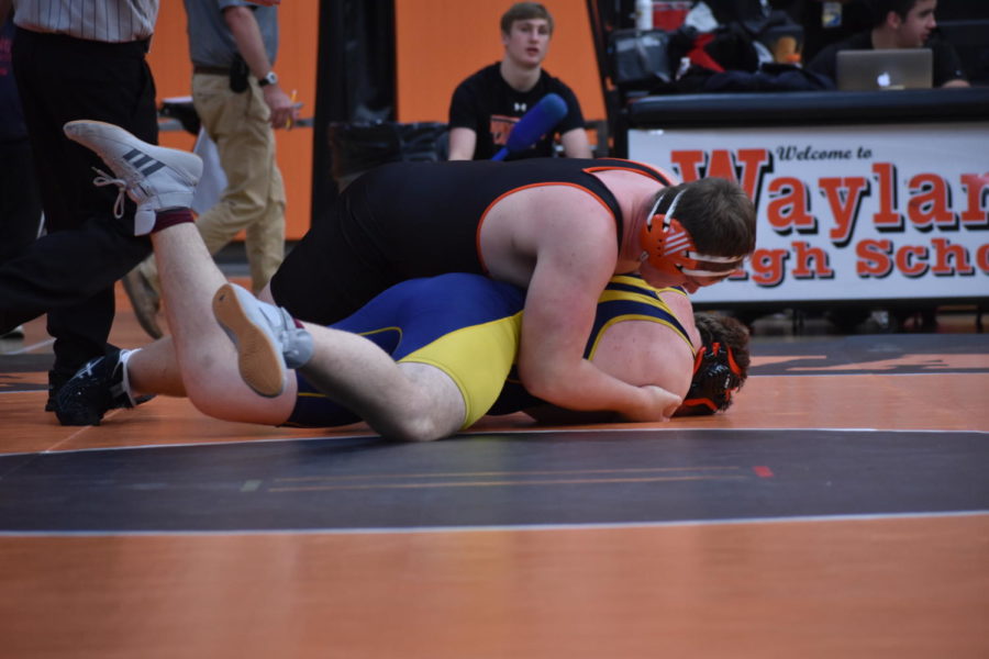 Senior Brooks Jones succesfully pins his Lexington opponent. In his previous match against Keefe Tech, Jones pinned his opponent in 17 seconds. 
