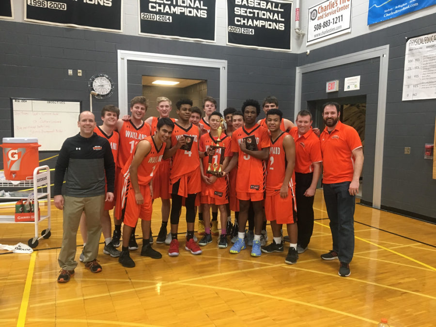 The+Wayland+boys+varsity+basketball+team+won+the+Barry+Hutchinson+Memorial+Holiday+tournament+at+Bellingham+High+School+on+Dec.+28+after+defeating+two+talented+teams.+%E2%80%9CUs+winning+was+a+big+wake-up+call+for+a+lot+of+other+schools+and+other+programs+because+they+didnt+expect+Wayland+to+win+anything%2C+sophomore+Jabari+Nurse+said.