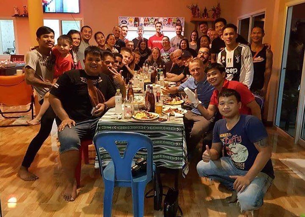 2018 graduate Peter Wolff shares a meal with Thai students. While staying in Thailand, Wolff was able to focus on his studies of Muay Thai. “I was staying in the middle of nowhere,” Wolff said. “There were rice fields all around, and the fun thing to do was to go to 7/11 and get a snack. It [was] good because there [were] not many distractions.”