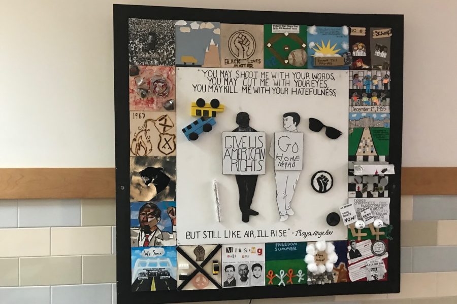 A+board+that+represents+black+history+in+the+WHS+history+wing.+The+collage+depicts+what+life+was+like+for+an+African+American+during+the+black+power+movement.+This+year%2C+the+WHS+POWER+club+is+working+with+the+administration+and+Student+Council+to+bring+Black+History+Month+to+the+forefront+of+students+awareness.+%E2%80%9CIn+previous+years%2C+we+haven%E2%80%99t+done+anything%2C%E2%80%9D+POWER+Club+president%2C+junior+Shawn+Bernier%2C+said.+%E2%80%9CThat%E2%80%99s+why+I+felt+that+this+year+there+definitely+needed+to+be+some+type+of+change+or+implementation+%5Bof+something+new%5D.%E2%80%9D