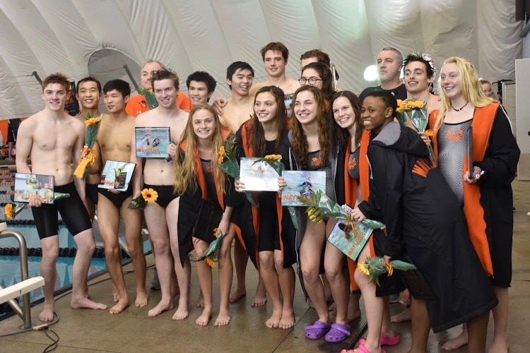 Seniors on the swim and dive team pose for one last photo as a group. The boys team won their third consecutive championship while the girls won their first since 2014. We had a lot of confidence going into this [season], boys senior captain Edmond Giang said. 