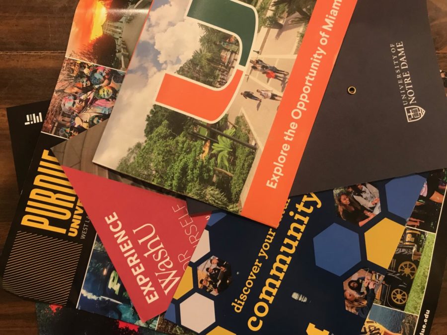 Pictured above is a pile of college mail. The climate surrounding college admissions has changed substantially over the past thirty years. There are a lot of similarities to what [students] do now, it’s just that every piece of it is less intensive, Rideout said.  