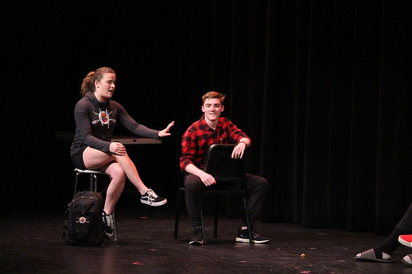 Seniors Clara Hurney and Eric McGonagle act as peer mentors for the freshmen class in a skit during the Senior Show. The show opened Friday, March 22 and attracted a full house of students and parents.