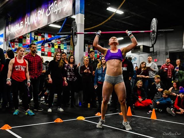 Sophomore Emma Gardner presses a barbell at a CrossFit competition. Gardner goes to CrossFit six days a week for four hours a day, and lives her lifestyle around CrossFit. I’d say CrossFit has completely changed my life, Gardner said. If youre going to do it you have to do it right, so you have to change almost everything about you. You have to eat healthy, sleep a ton, have the mental mindset and mental toughness to be able to keep going and not give up.