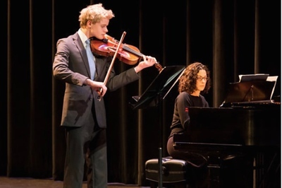 Junior Tristan Wolff playing the viola with music teacher Whitney Tandon on piano. Wolff has been playing the viola since third grade. "I knew I was going to play a string instrument, and I am glad I picked the viola," Wolff said.