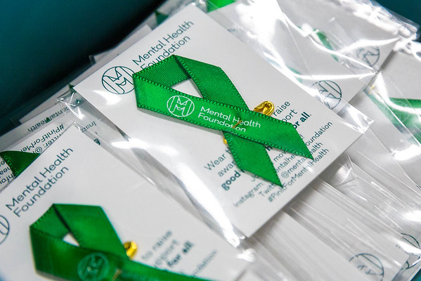 A green ribbon  symbolizes mental health awareness. May is Mental Health Awareness Month. WSPNs Meredith Prince discusses her personal experiences with mental health and the stigma around it.