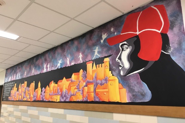 Pictured above is the mural in the English wing. Seniors Amelia Ao and Yana Lipnesh designed this mural as a part of a school-wide competition. “Our design tries to encompass and balance themes of both childhood and adulthood, dreams and reality, freedom and hope for a greater future,” Ao and Lipnesh wrote in their write-up. 