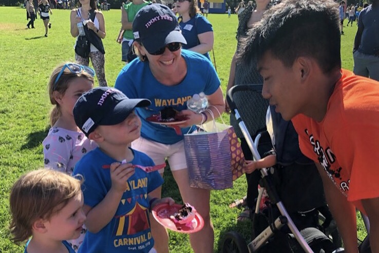 Sophomore Ben Chen talks to Annie (left), Ellie (middle) and Leah Levine about being chosen as the honorary captains for the annual Kicks for Cancer soccer game. "They'll be with us on the sideline completely kitted out in pink because we're wearing pink this year, so I think they're going to help as much as possible,” senior captain Alex Kashian said. “I think it'll be a huge inspiration for the team going into the game.”