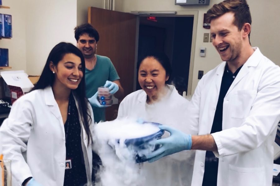 Senior Ciara Murphy works with dry ice, along with technicians James and Stephanie. “A lot of people when they think of medicine, they just think of surgery. They don’t necessarily think about research. In my mind, research is the future,” Murphy said.